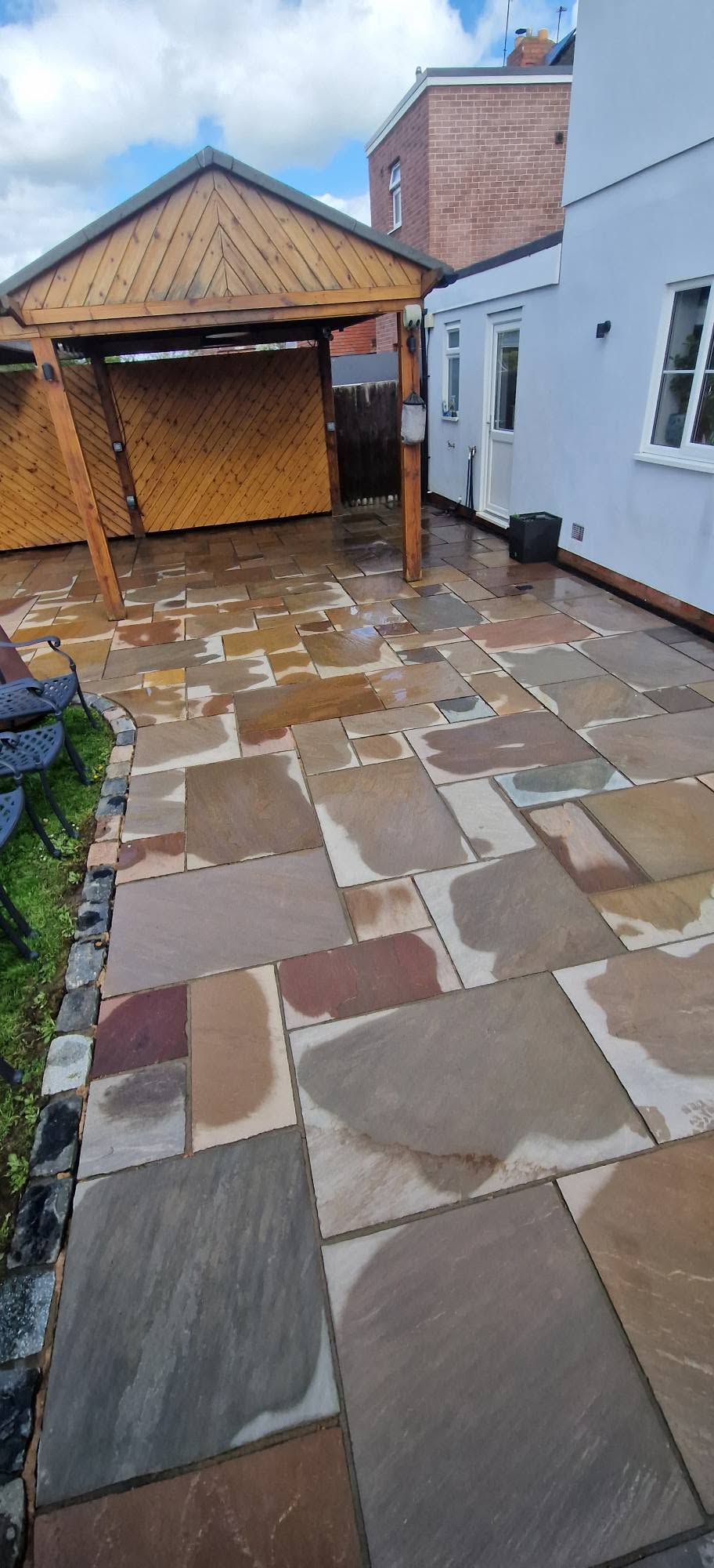 Restored sandstone patio after professional patio cleaning and rejointing in Redditch, Worcestershire