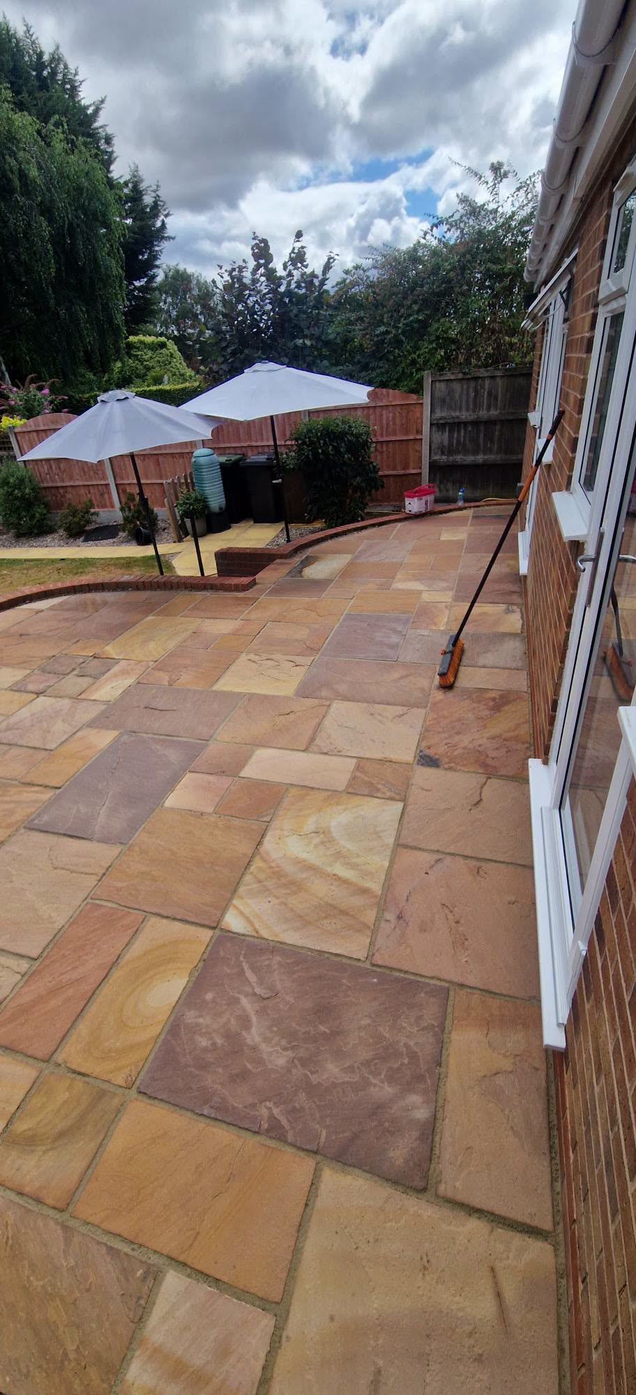 Restored sandstone patio after professional patio cleaning and rejointing in Redditch, Worcestershire