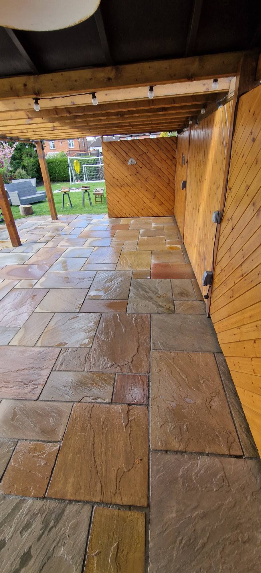 Restored sandstone patio after professional patio cleaning and rejointing in Redditch, Worcestershire