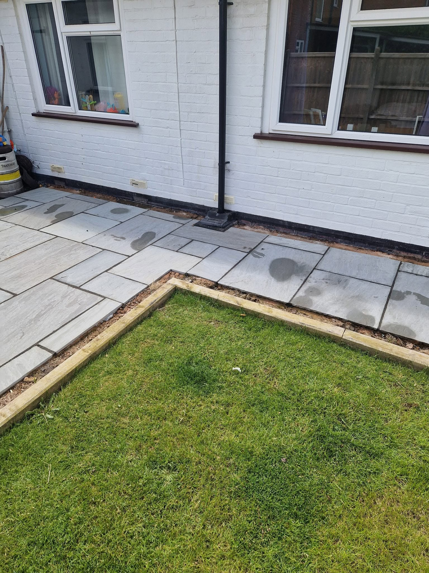 Restored sandstone patio after professional patio cleaning and rejointing in Redditch, Worcestershire