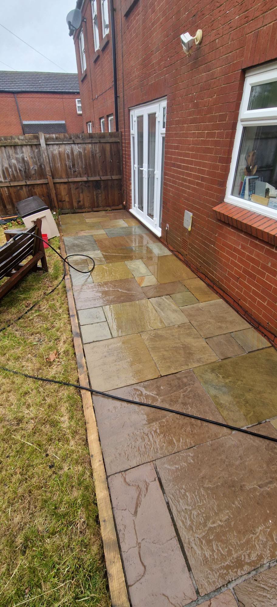 Restored sandstone patio after professional patio cleaning and rejointing in Redditch, Worcestershire
