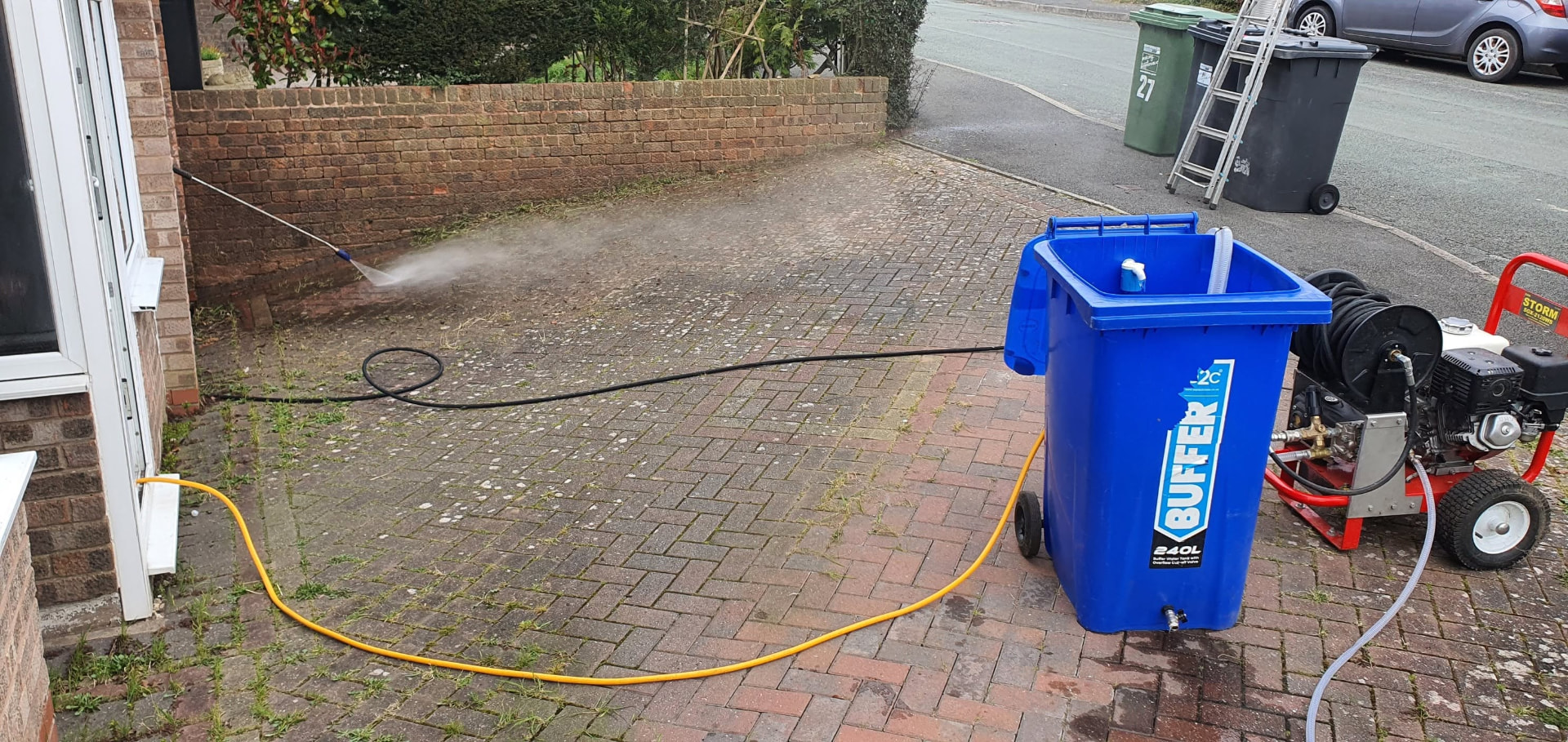Pressure washing a block paved driveway with a buffer tank in Redditch, Worcestershire