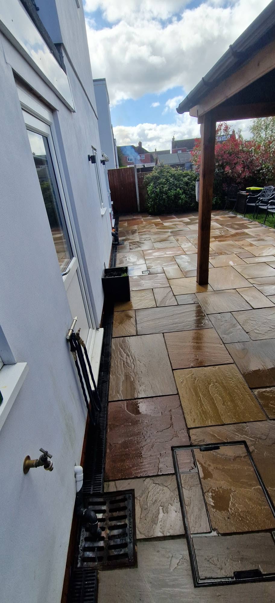 Restored sandstone patio after professional patio cleaning and rejointing in Redditch, Worcestershire
