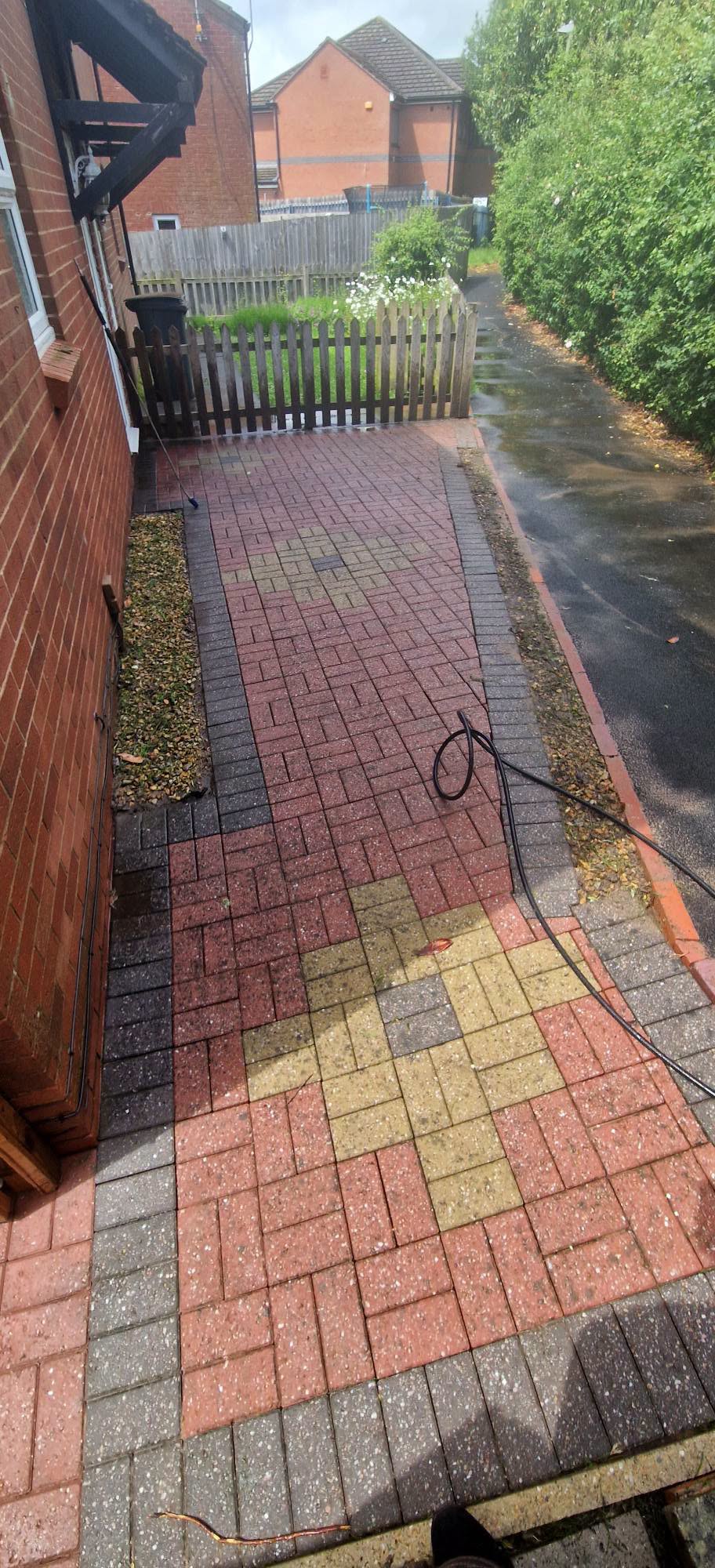 The same block paving path weed free with sharp red and grey pavers after cleaning