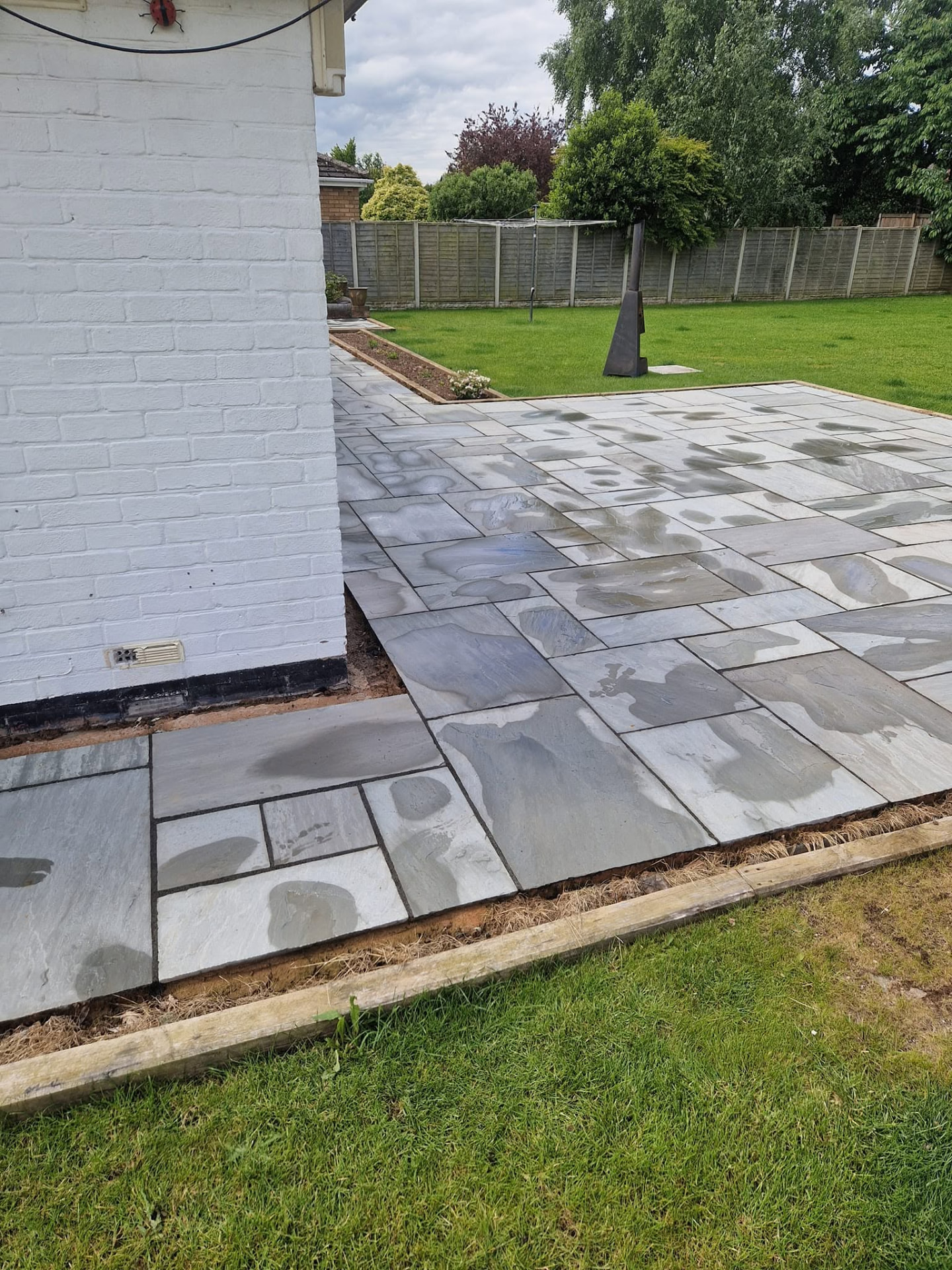 Restored sandstone patio after professional patio cleaning and rejointing in Redditch, Worcestershire