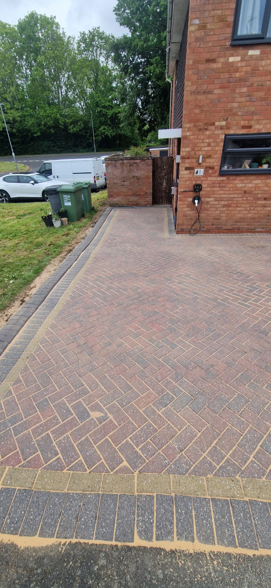 The same front driveway cleaned and re-jointed with crisp brick paving