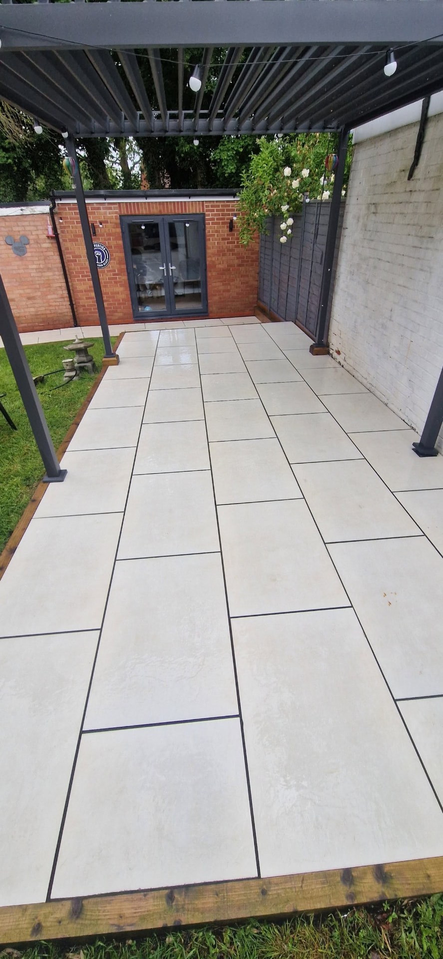 Restored sandstone patio after professional patio cleaning and rejointing in Redditch, Worcestershire